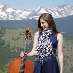 Greta with her cello in the mountains